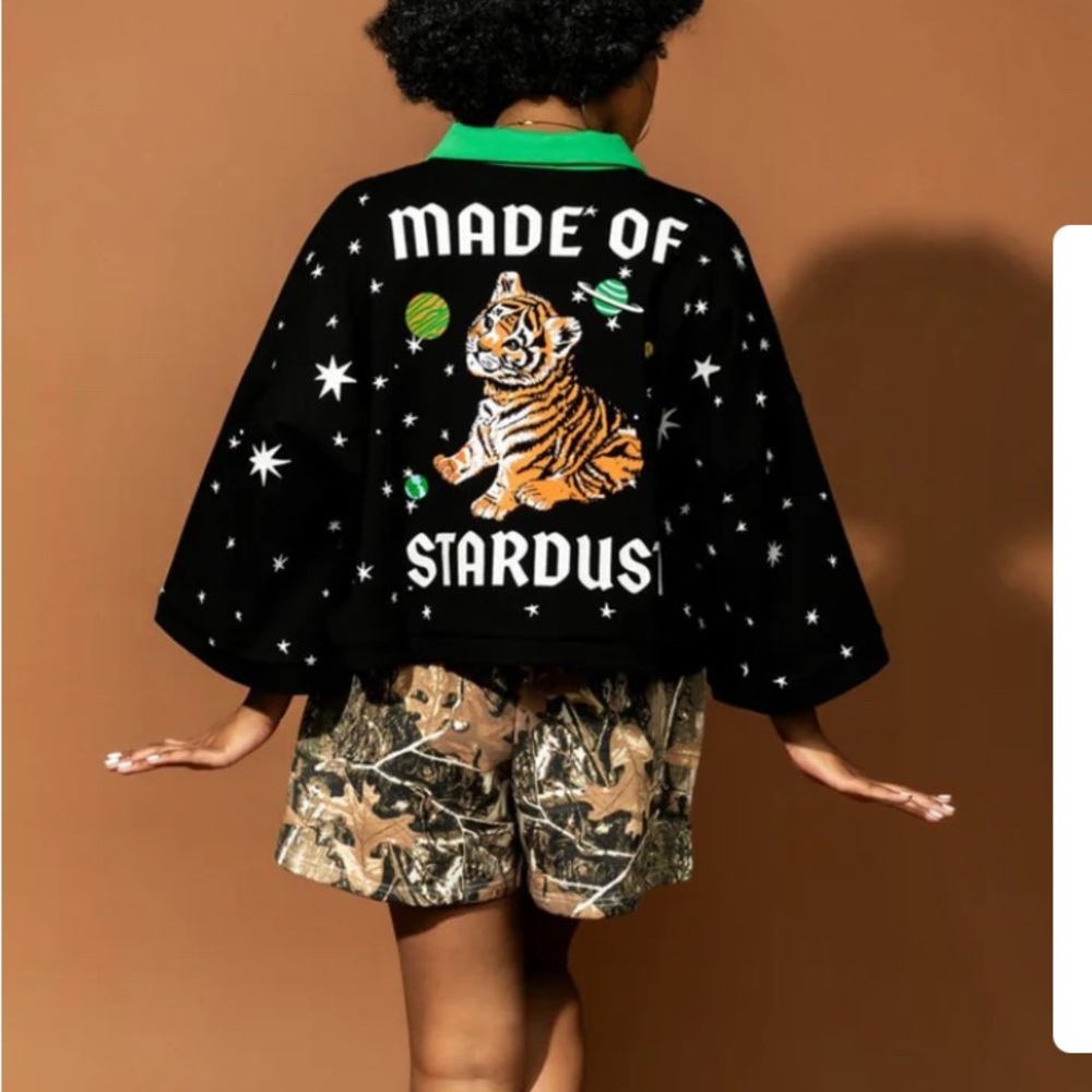 Dressed in LALA Black 'Made of Stardust' Top with Green Collar